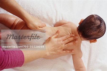 Woman Massaging Baby