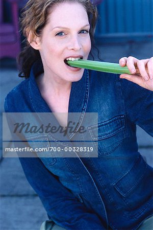 Woman Eating Celery
