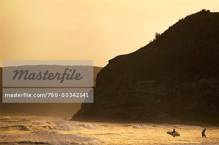 People Surfing at Dusk Geriba Beach Buzios, Brazil