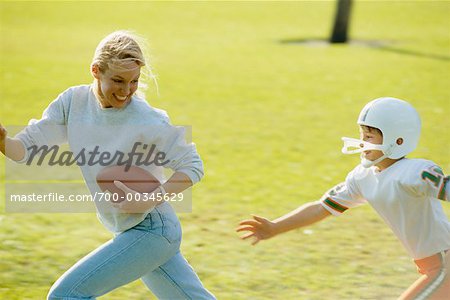 Mother and Son Playing Football