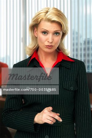 Portrait of Businesswoman Pointing Finger