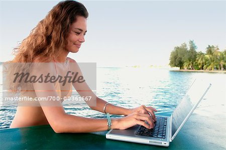 Woman Using Laptop Raiatea, French Polynesia