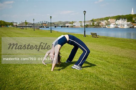 Woman Stretching in Park