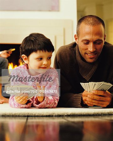 Father Playing Cards with Daughter