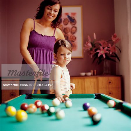 Mother and Daughter Playing Pool