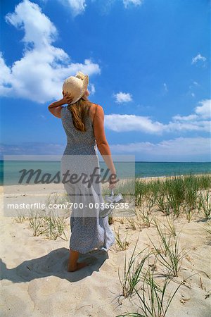 Woman Walking on Beach