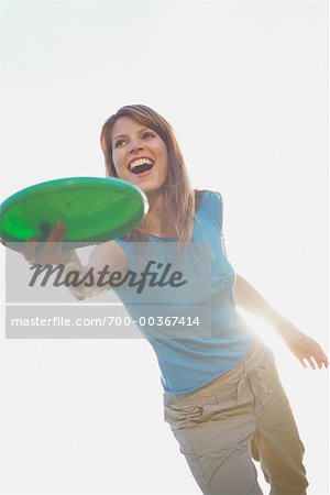 Woman Throwing Frisbee