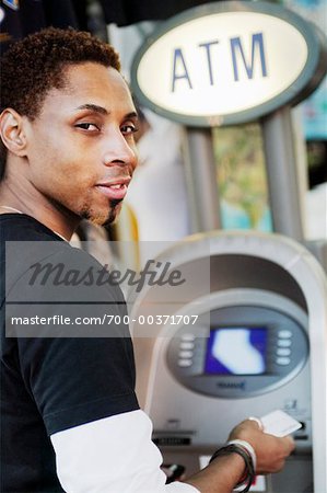 Man Using Banking Machine