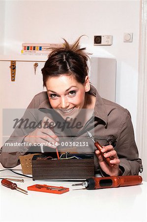 Young woman with fuse-box