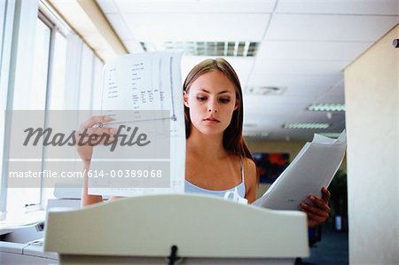 Woman about to shred paper