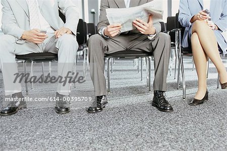 Businesspeople seated at conference