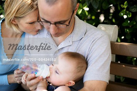 Parents Feeding Baby