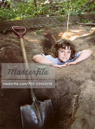 Boy Digging a Hole