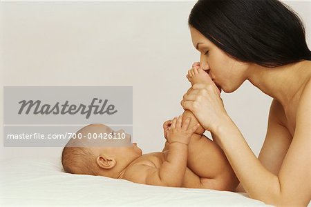 Mother Kissing Baby's Feet