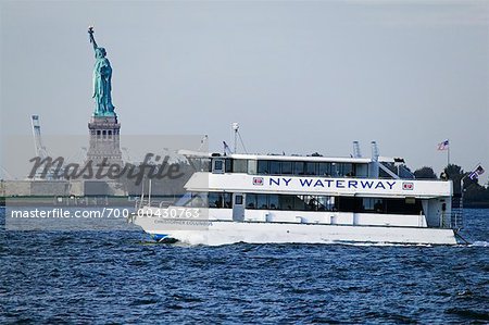 Water Taxi and the Statue of Liberty, New York City, New York, USA