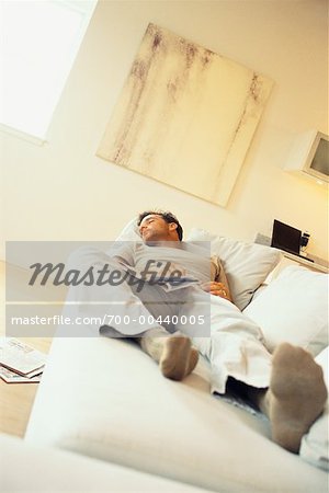 Man Sleeping on Couch