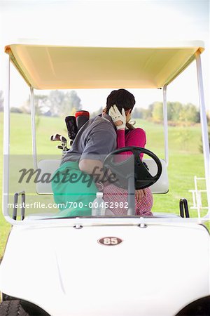 Couple Making Out in Golf Cart