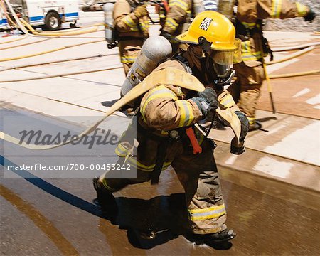 Firefighter Pulling Hose
