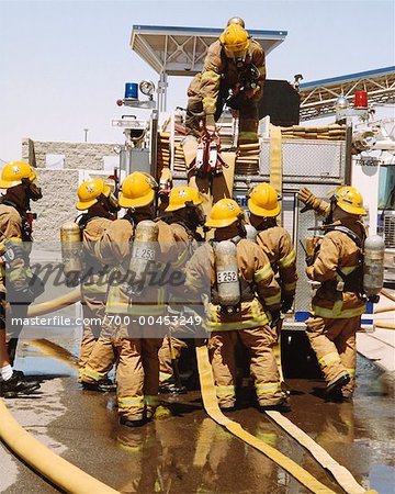 Firefighters Getting Equipment from Fire Truck