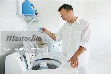 Man Loading Washing Machine