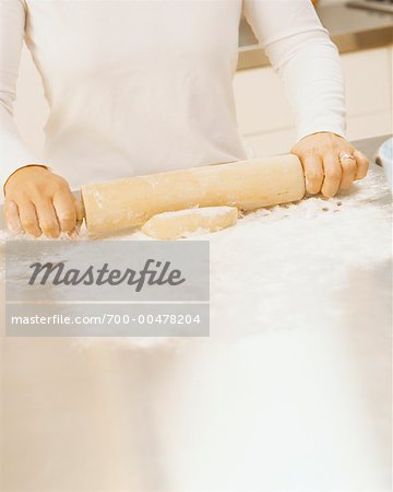 Woman Rolling Dough