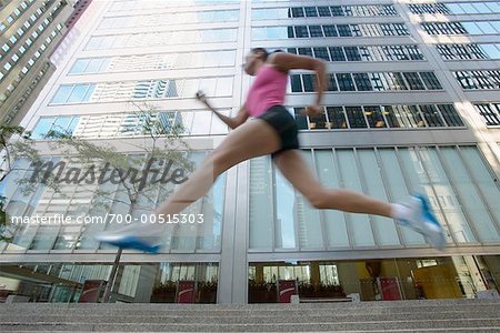 Runner Running Down City Street