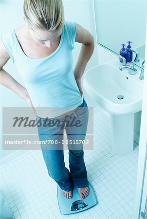 Woman on Scale in Bathroom