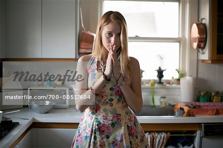 Portrait of Woman Standing In Kitchen