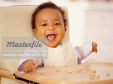 Portrait of Child Sitting in High Chair