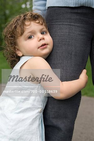 Girl Holding Mother's Leg