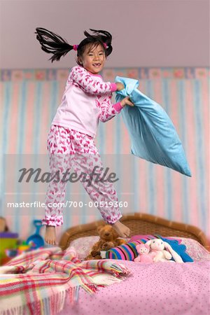 Child Jumping on Bed