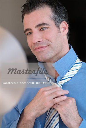 Man Tying Necktie