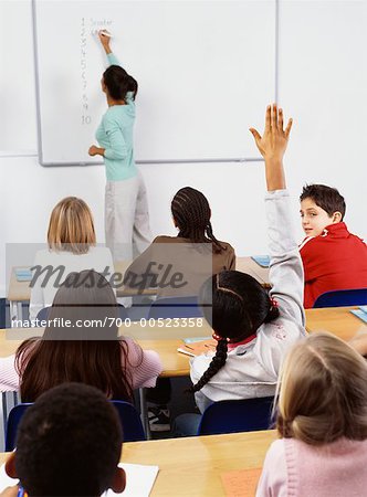 Student with Hand Raised in Classroom