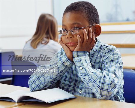 Student Looking Bored in Classroom