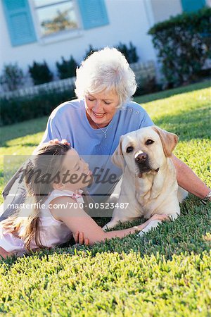 Grandmother, Granddaughter and Dog Outdoors