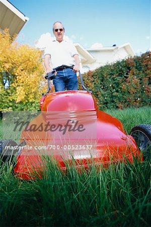 Man Mowing the Lawn, Calgary, Alberta, Canada