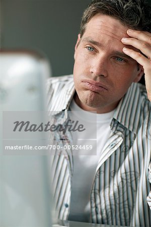 Man Looking at Computer Screen