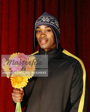 Portrait d'un homme avec des fleurs