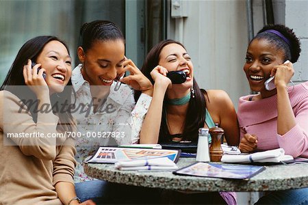 Group of Friends Talking on Their Cellphones