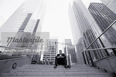 Businessman Sitting on Steps