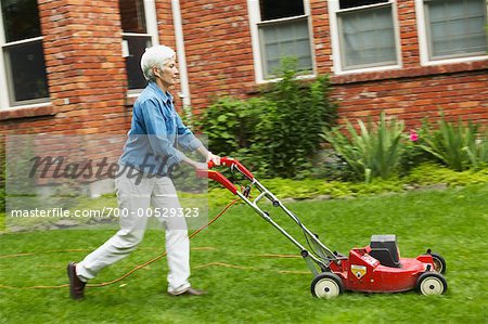 Woman Mowing Lawn