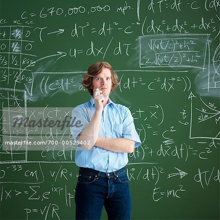 Portrait of Man Standing in Front of a Chalkboard