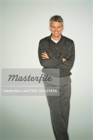 Portrait of Man Leaning Against Wall