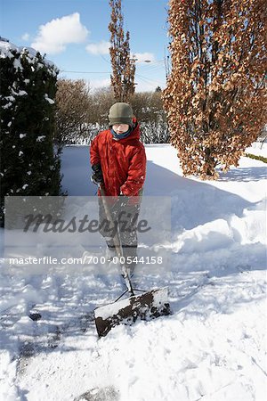 Boy Shovelling Snow