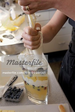 Woman's Hands Making Dessert