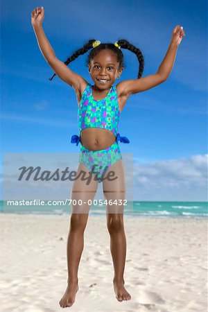 Girl Jumping on Beach