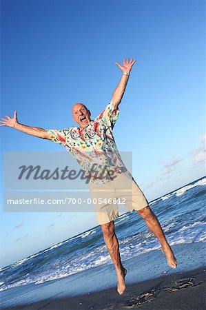 Man Jumping on Beach