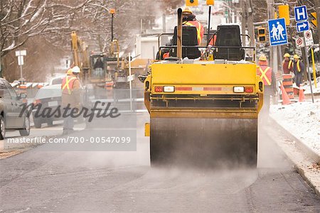 Road Workers Paving Road