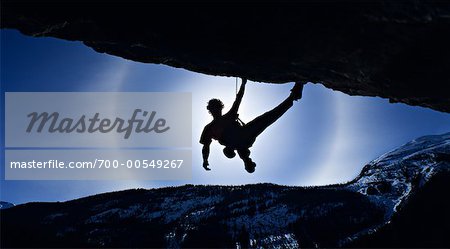 Rock Climber rétroéclairé par Sundog, Parc National Banff, Alberta, Canada