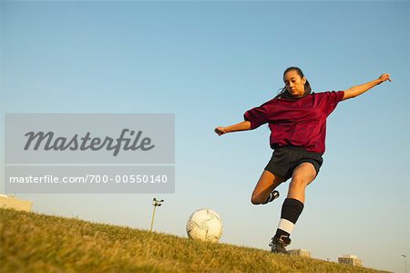 Girl Kicking Soccer Ball